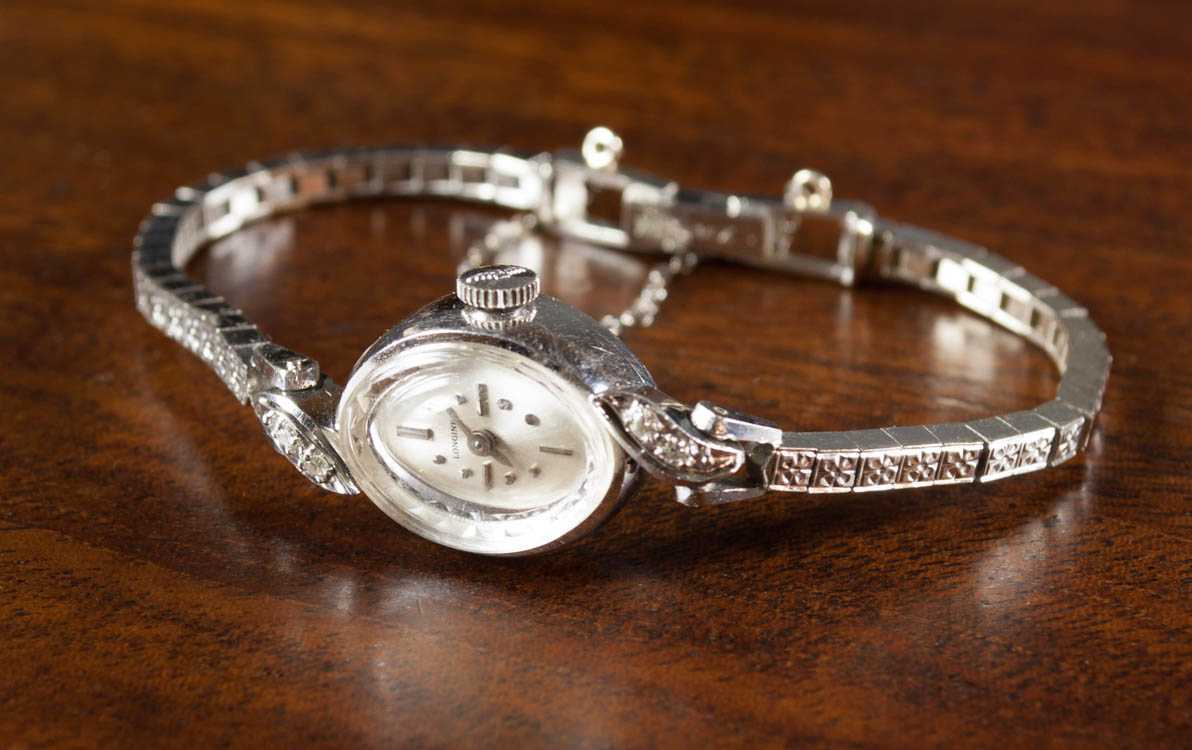 Appraisal: LADY'S DIAMOND AND FOURTEEN KARAT WHITE GOLD WRIST WATCH Longines