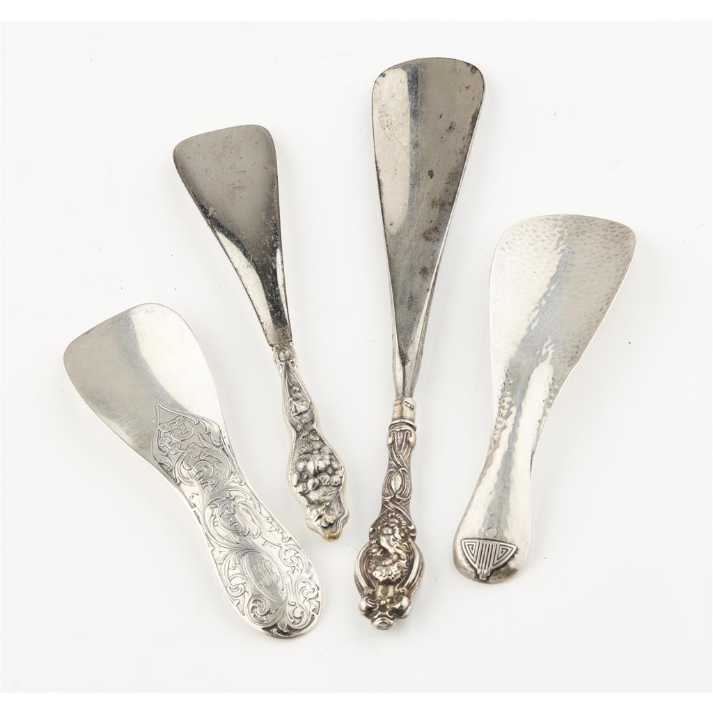 Appraisal: A group of four shoe horns two marked sterling one