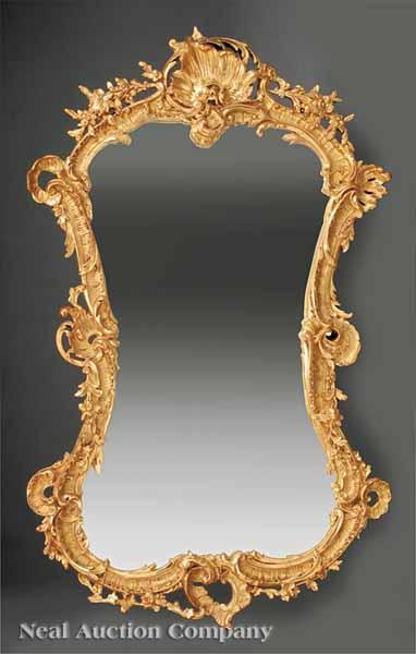 Appraisal: A Louis XV-Style Carved and Gilded Mirror the foliate rocaille