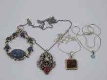 Appraisal: A mixed lot comprising a silver mask pendant two further