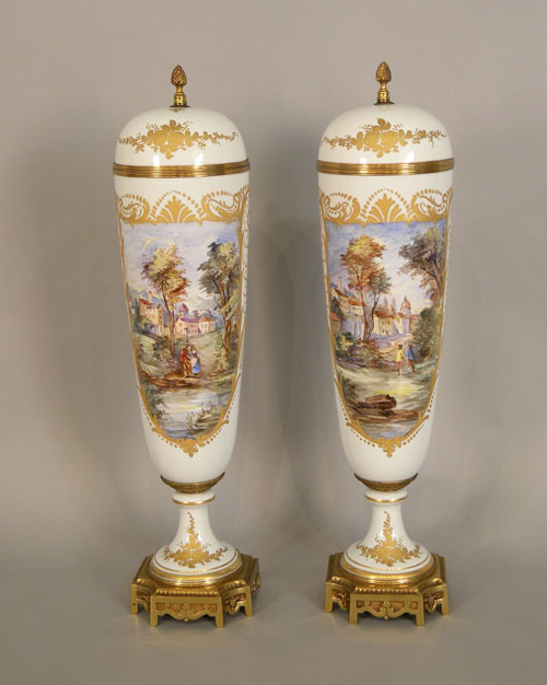 Appraisal: Pair of Sevres style painted porcelain covered urns h