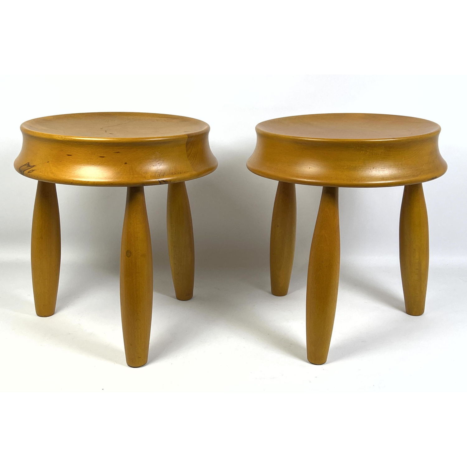 Appraisal: A pair of wood stools in the manner of Jean