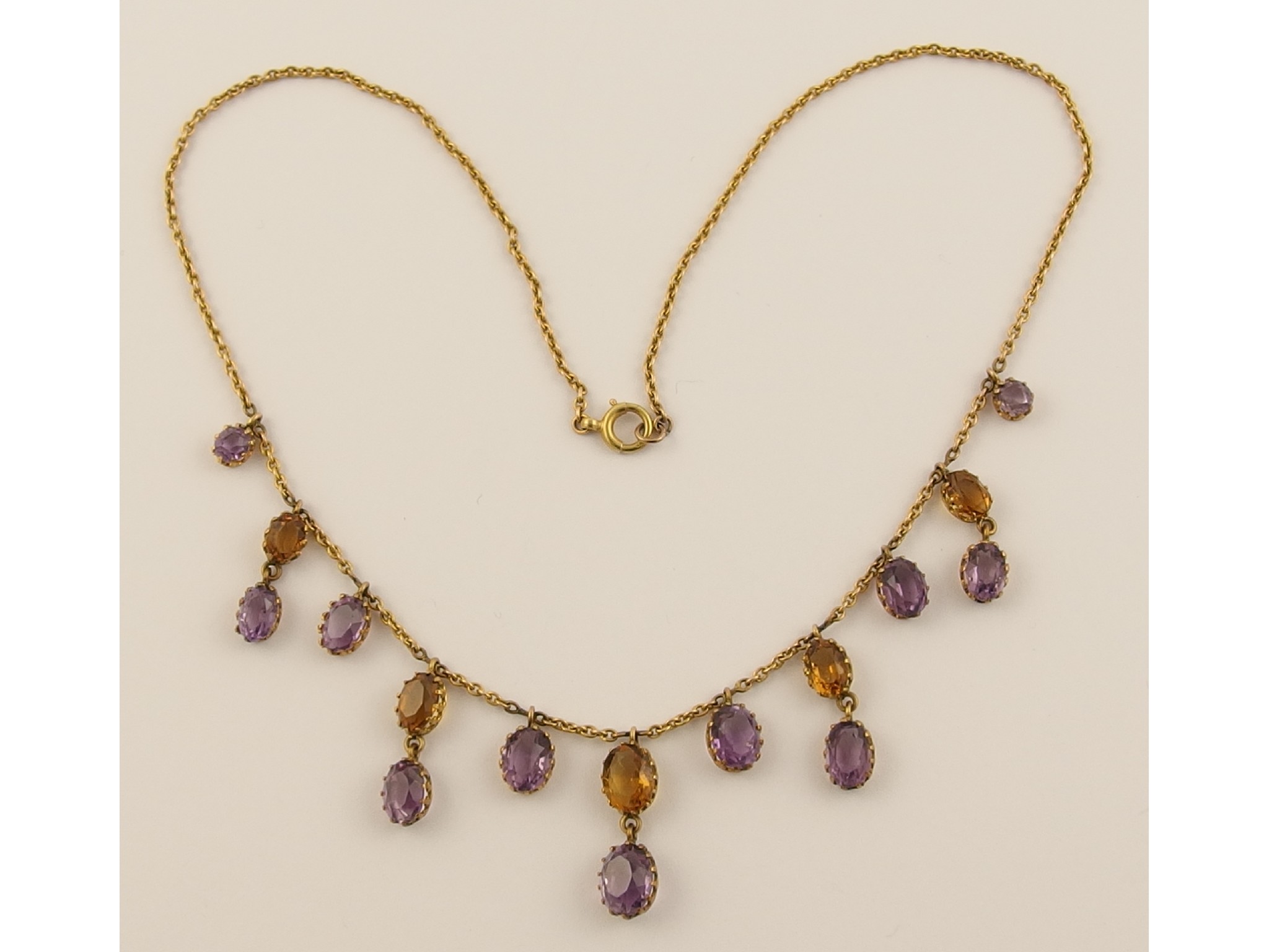 Appraisal: An Edwardian citrine and amethyst festoon necklace