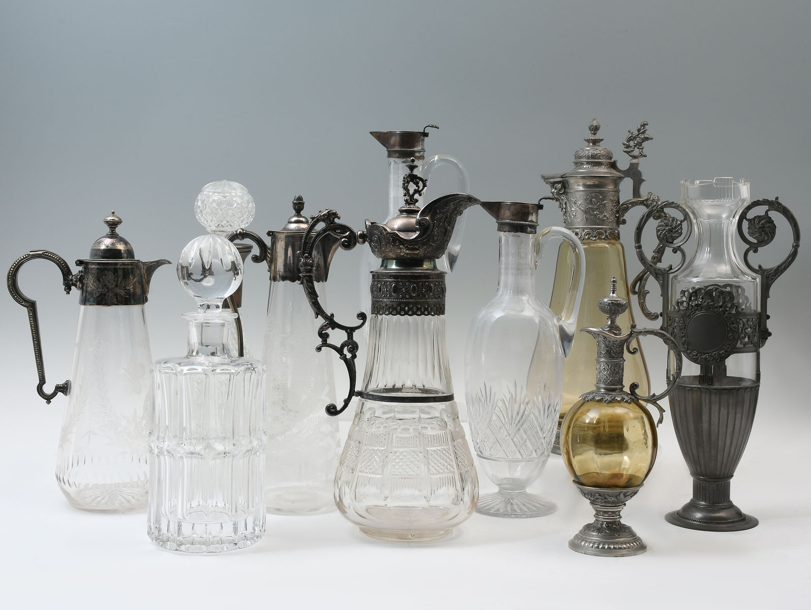 Appraisal: PC CRYSTAL METAL MOUNTED DECANTERS CLARET JUGS Including continental metal