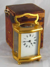 Appraisal: A gilt brass clock in original travelling box case AF