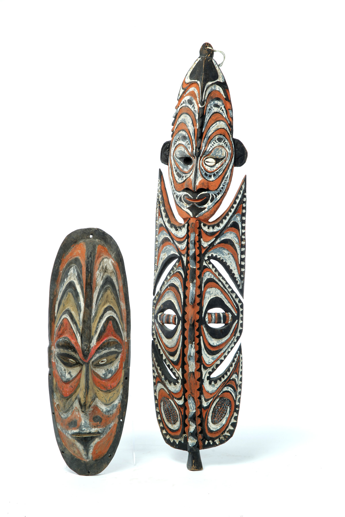 Appraisal: TWO PAPUA NEW GUINEA CARVED MASKS Twentieth century Wooden masks