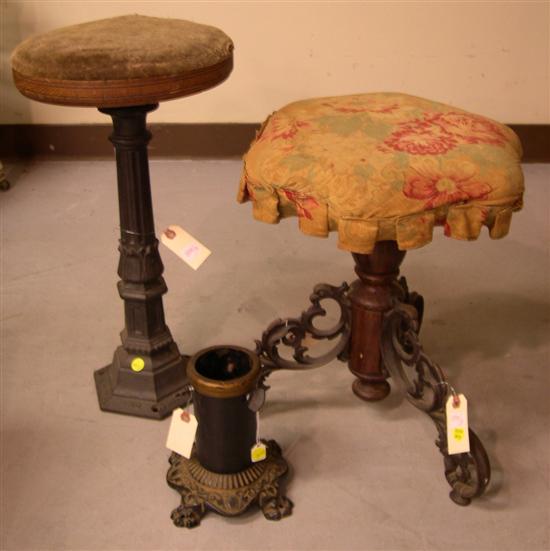 Appraisal: Victorian stool with turned wood standard and three griffin and