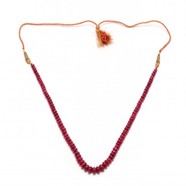 Appraisal: GRADUATED RUBY BEAD NECKLACE Necklace comprised of polished ruby rondelle