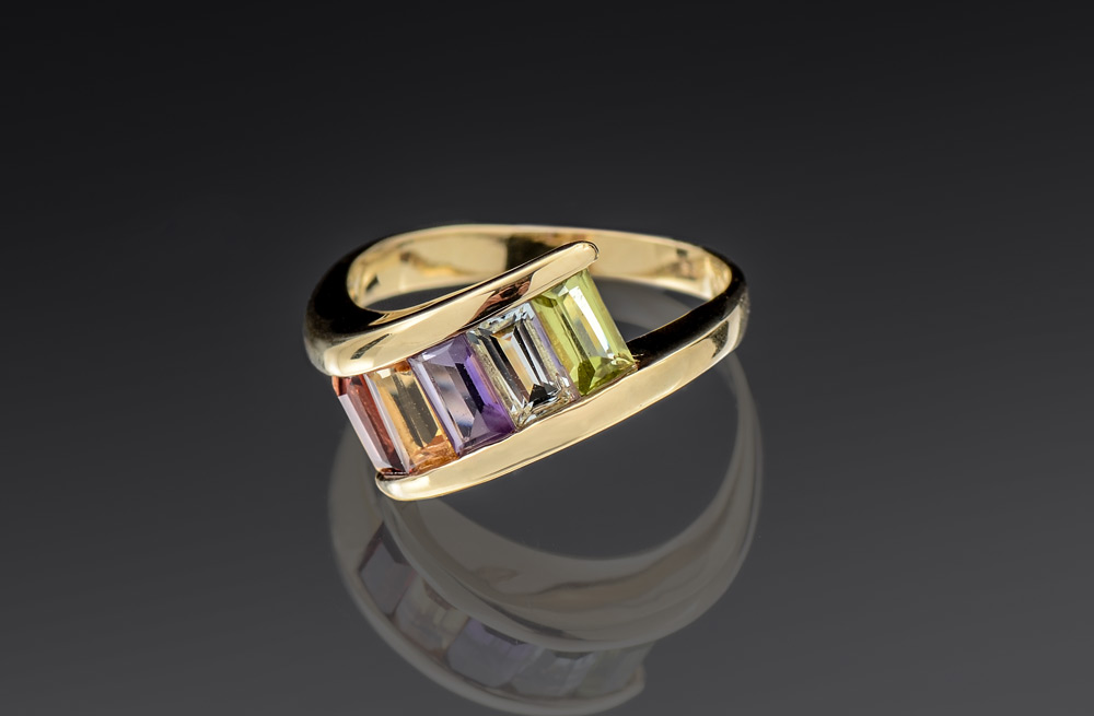 Appraisal: MULTI-COLOR GEMSTONE RING Four emerald cut stones amethyst citrine garnet