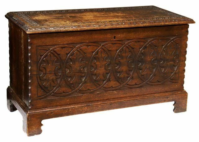 Appraisal: English carved oak storage trunk early th c hinged top