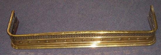 Appraisal: A rectangular pierced brass fender cm wide