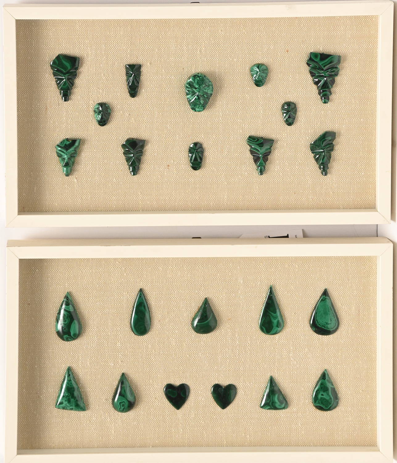 Appraisal: FRAMED GROUPS CARVED MALACHITE TOGGLES Comprised of framed groups toggles