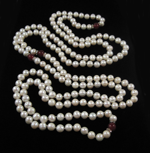 Appraisal: ROPE LENGTH PEARL AND RHINESTONE NECKLACE measuring - inches in