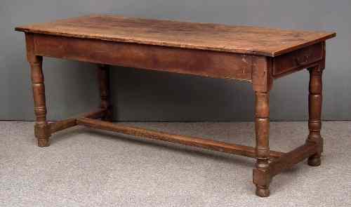 Appraisal: An old French elm and fruitwood rectangular kitchen table with