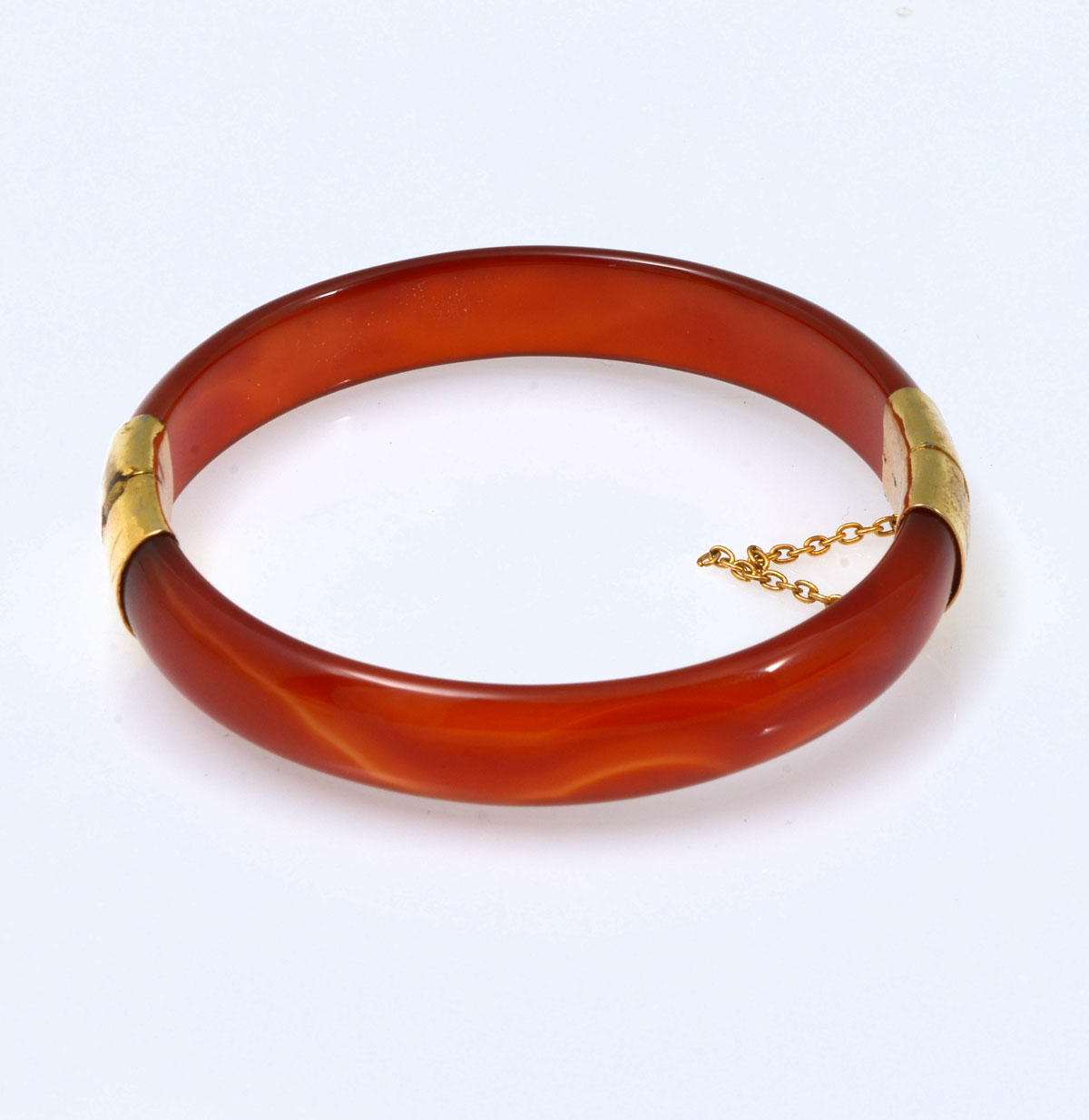 Appraisal: K CARNELIAN BANGLE BRACELET K yellow gold carnelian hinged bangle