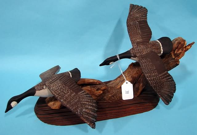 Appraisal: Pair of flying Geese on driftwood by Gary Cope Marcus