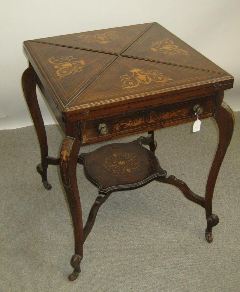 Appraisal: A VICTORIAN ROSEWOOD ENVELOPE CARD TABLE with marquetry and stringing