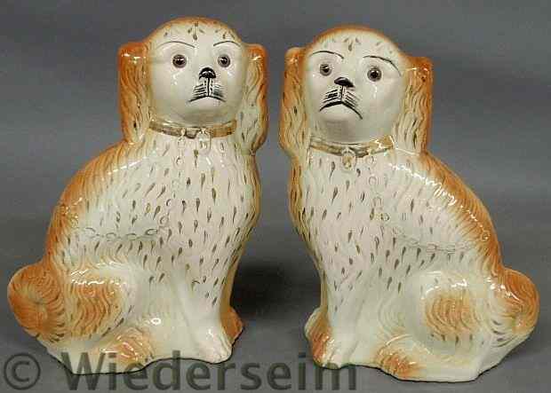 Appraisal: Two large Staffordshire seated spaniels late th c h x