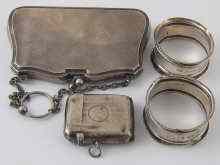 Appraisal: A silver purse with leather compartmented interior and pendant ring