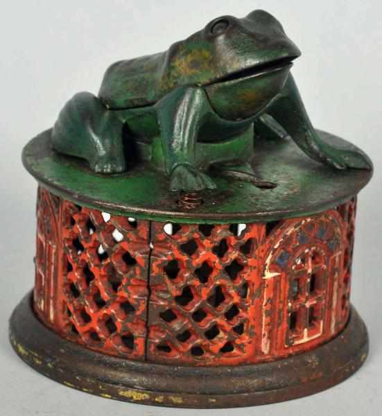 Appraisal: Cast Iron Frog on Lattice Mechanical Bank Manufactured by J