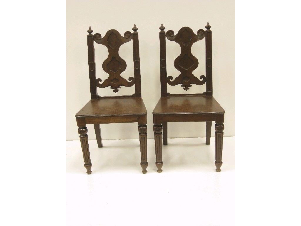 Appraisal: Pair of th Century mahogany Hall Chairs with shaped and