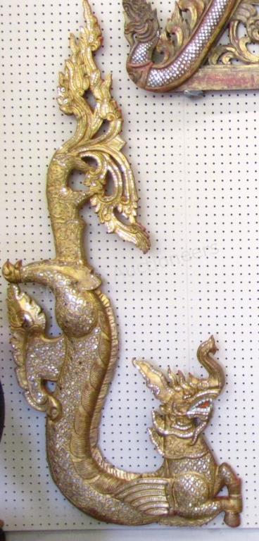 Appraisal: A pair of Balinese elephant-dragon carvings wall-mount with painted finish