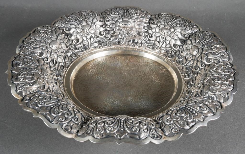 Appraisal: Silver repousse basket with hammered texture in the center surrounded