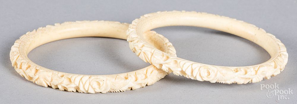 Appraisal: Two Chinese carved bone bangle bracelets Two Chinese carved bone