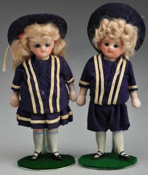 Appraisal: Pair of All Bisque French Mignonnette Dolls Description Sweet round