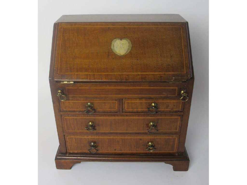 Appraisal: An Edwardian miniature mahogany bureau the sloping top inlaid with