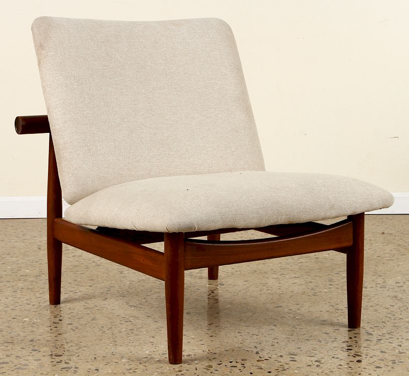 Appraisal: UPHOLSTERED CHAIR MANNER OF FINN JUHL An upholstered chair in