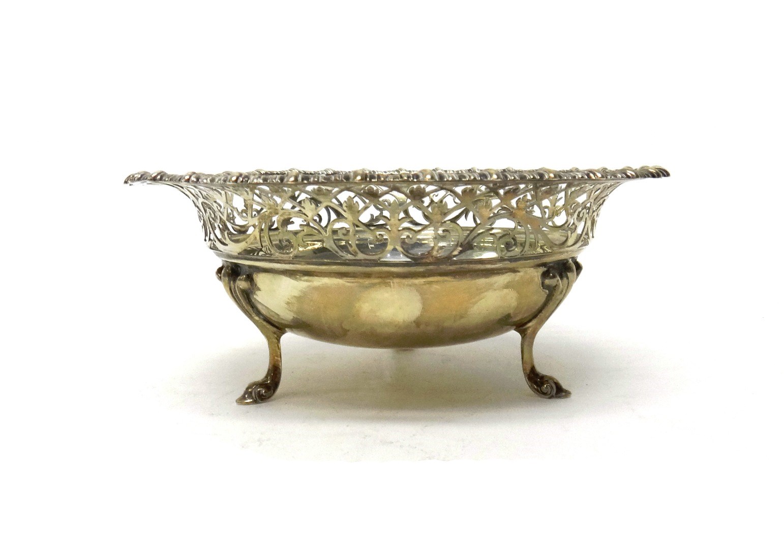 Appraisal: A silver circular bonbon bowl with a scroll pierced wide