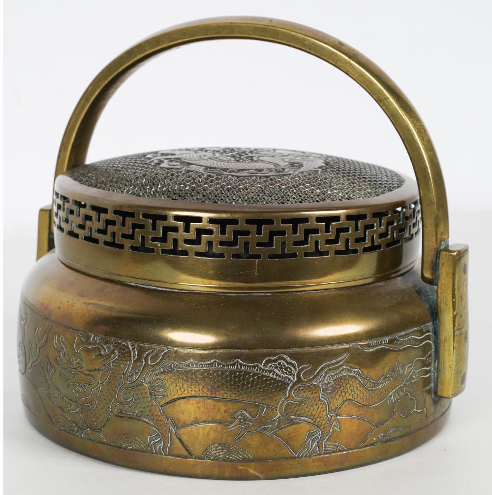 Appraisal: CHINESE BRASS HAND WARMERwith an incised dragon motif on the