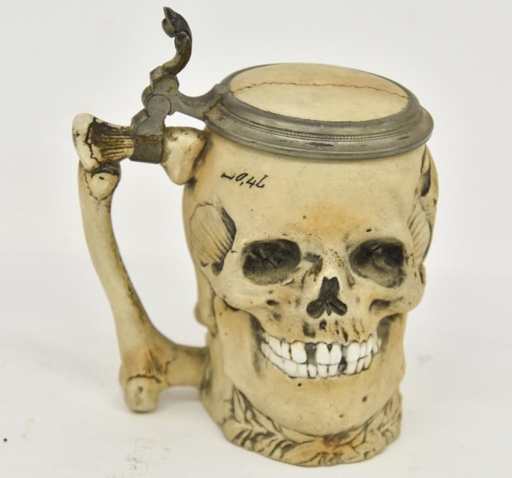 Appraisal: German porcelain skull stein with pewter hinge liters and bone