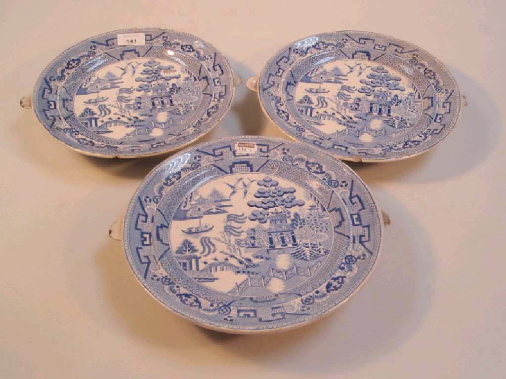 Appraisal: Three thC blue and white pottery warming plates printed with