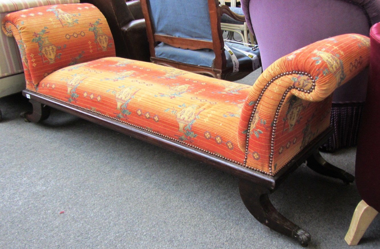 Appraisal: A th century mahogany window seat with roll over ends