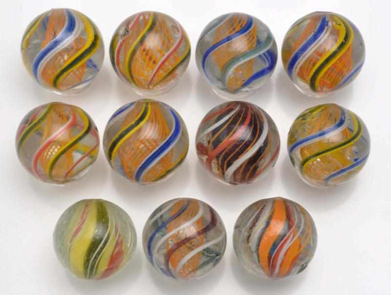 Appraisal: Lot of Handmade Swirls Description Includes eight orange latticinos one