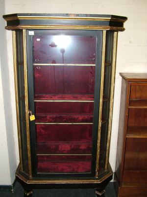 Appraisal: A Victorian gilt ebonised vitrine the shaped moulded cornice above