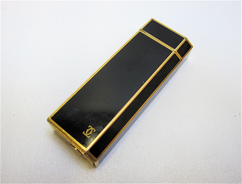 Appraisal: CARTIER PARIS BLACK ENAMEL CIGARETTE LIGHTER Cartier logo on one