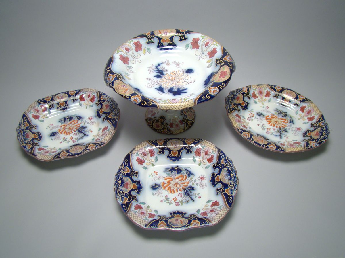 Appraisal: FOUR GAUDY IRONSTONE SERVING PIECES Mid- th CenturyFooted compote height