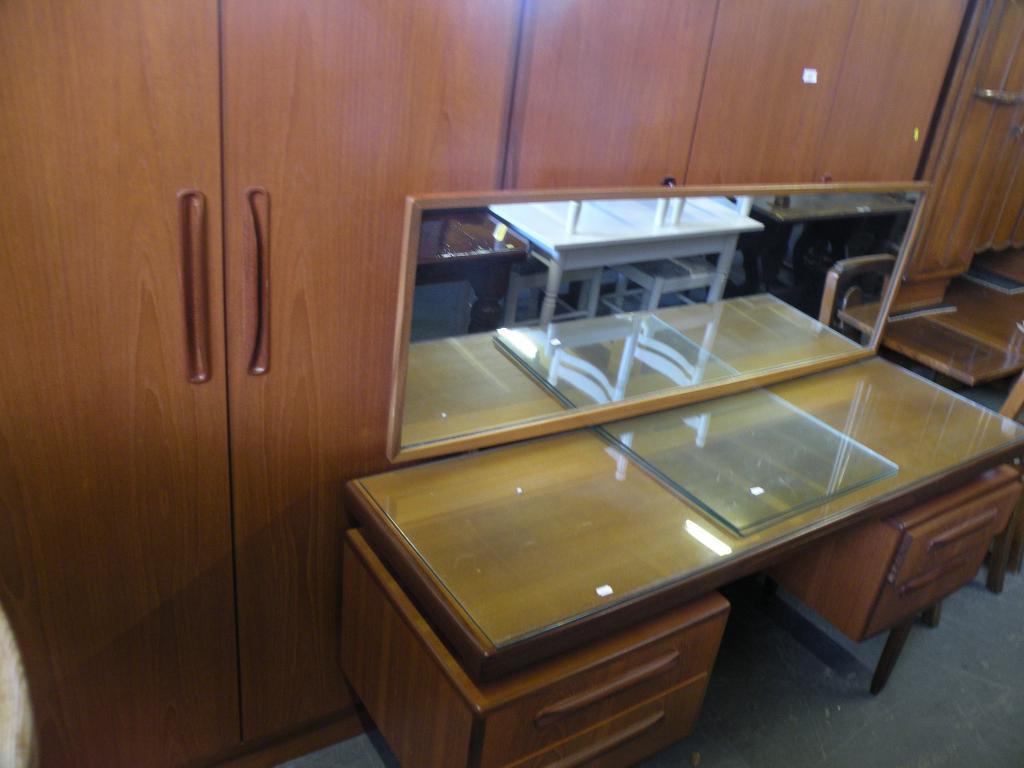 Appraisal: A 'G' plan three door wardrobe a dressing table and