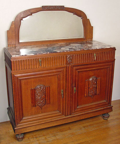 Appraisal: OAK ENGLISH DECO BUFFET Marble top cabinet under shaped and