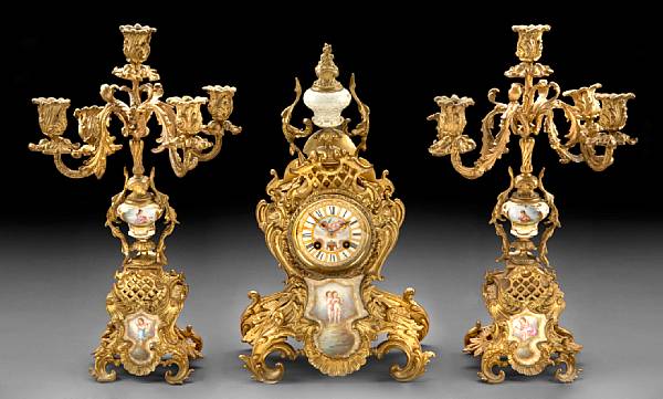 Appraisal: A French gilt bronze and porcelain mounted clock garniture late