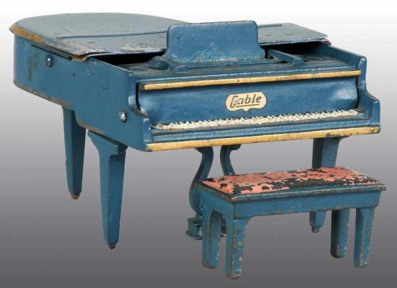 Appraisal: Cast Iron Tin Arcade Toy Grand Piano with Bench Description