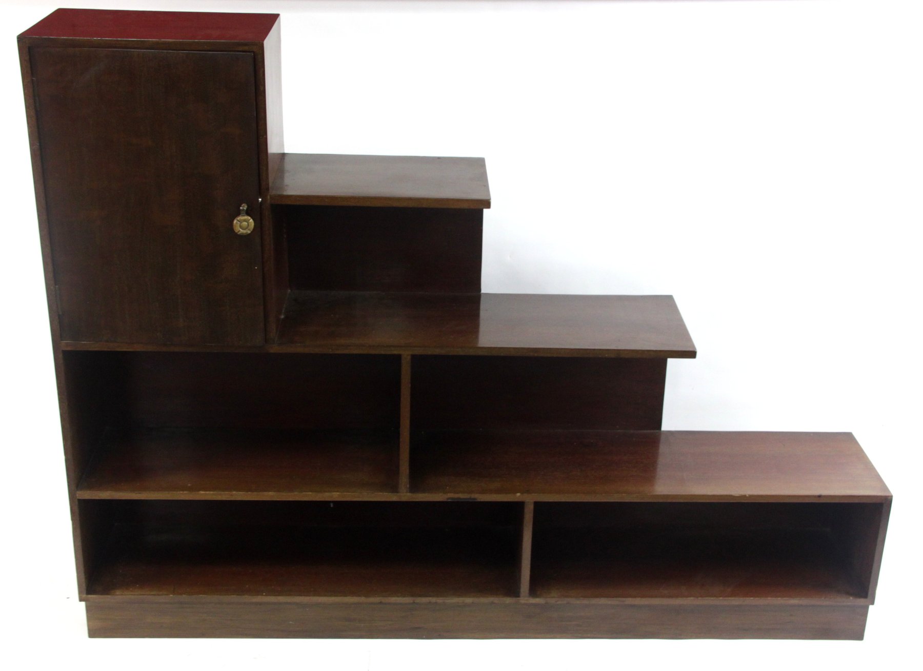 Appraisal: An Art Deco Style open bookcase of stepped form surmounted