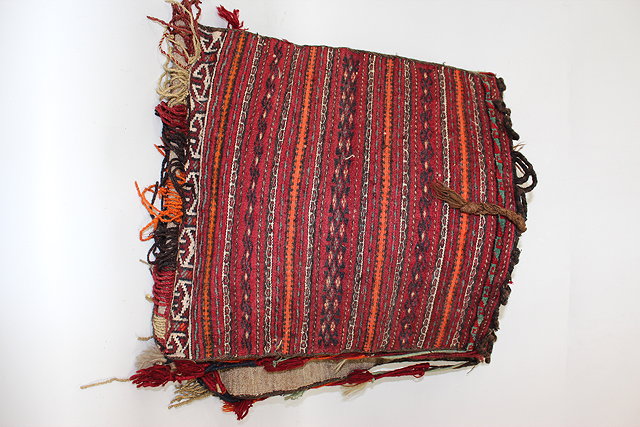 Appraisal: A MIDDLE EASTERN WOVEN CAMEL BAG together with a part