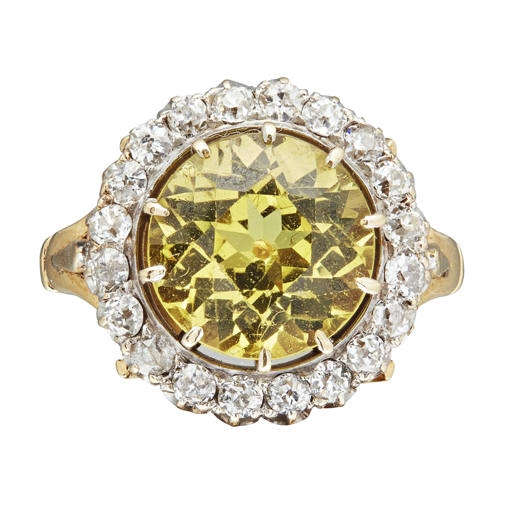 Appraisal: A yellow sapphire and diamond set ring claw set with