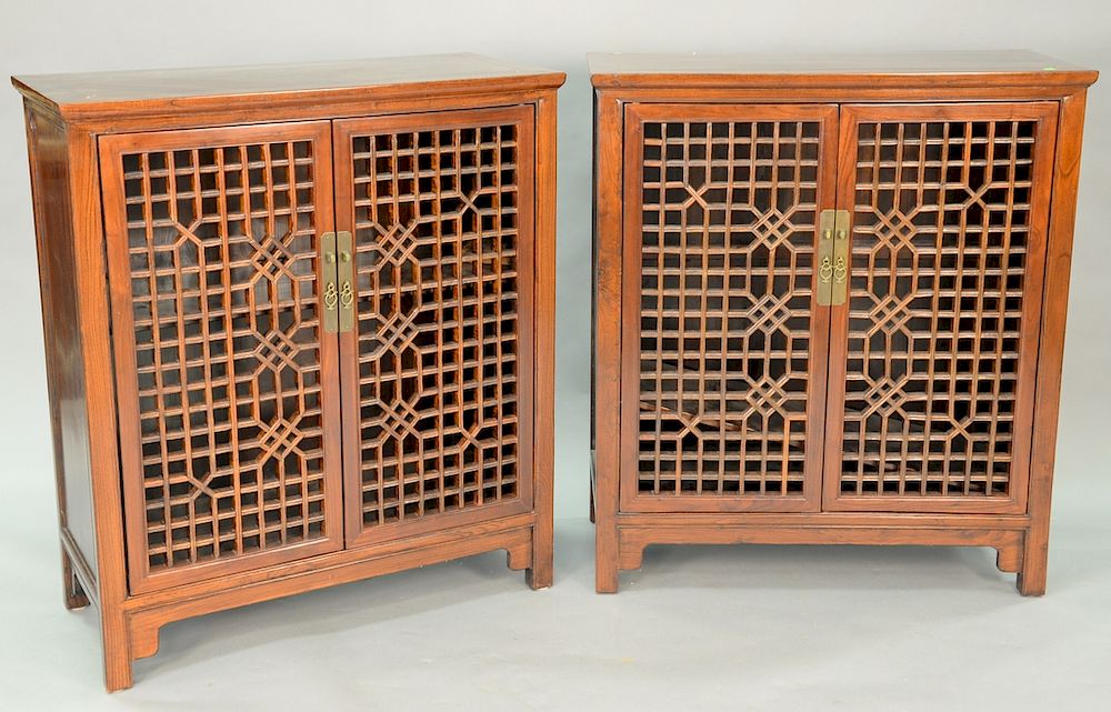 Appraisal: Pair Chinese style contemporary rosewood two door cabinets each with