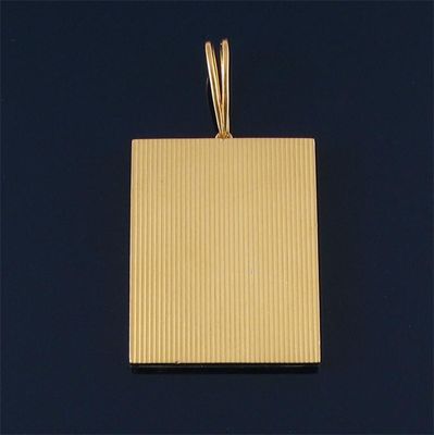 Appraisal: A folding gold frame pendant by Cartier with ribbed front