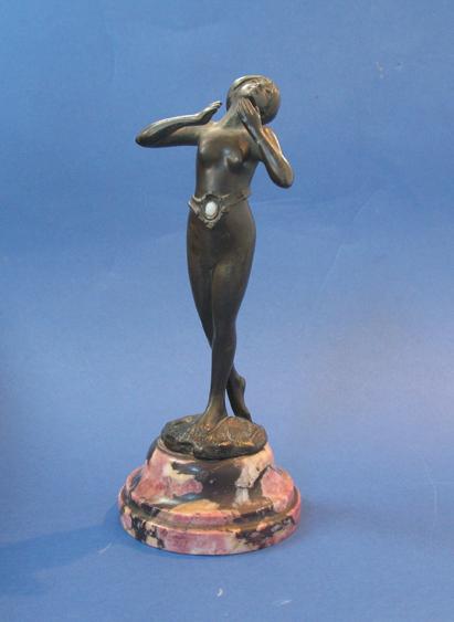 Appraisal: AN ART NOUVEAU STYLE BRONZE SCULPTURE of a naked maiden